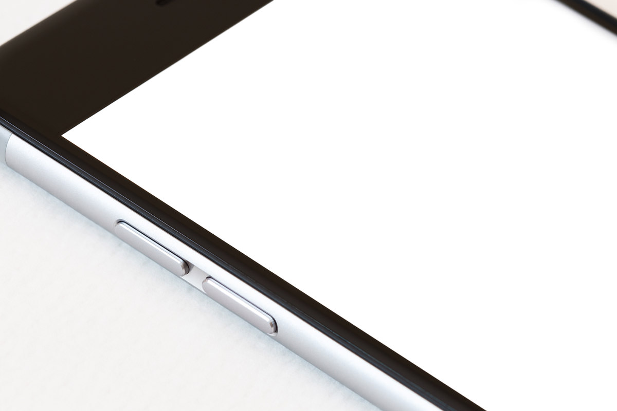 iPhoneに白い画面を表示させているイメージ画像