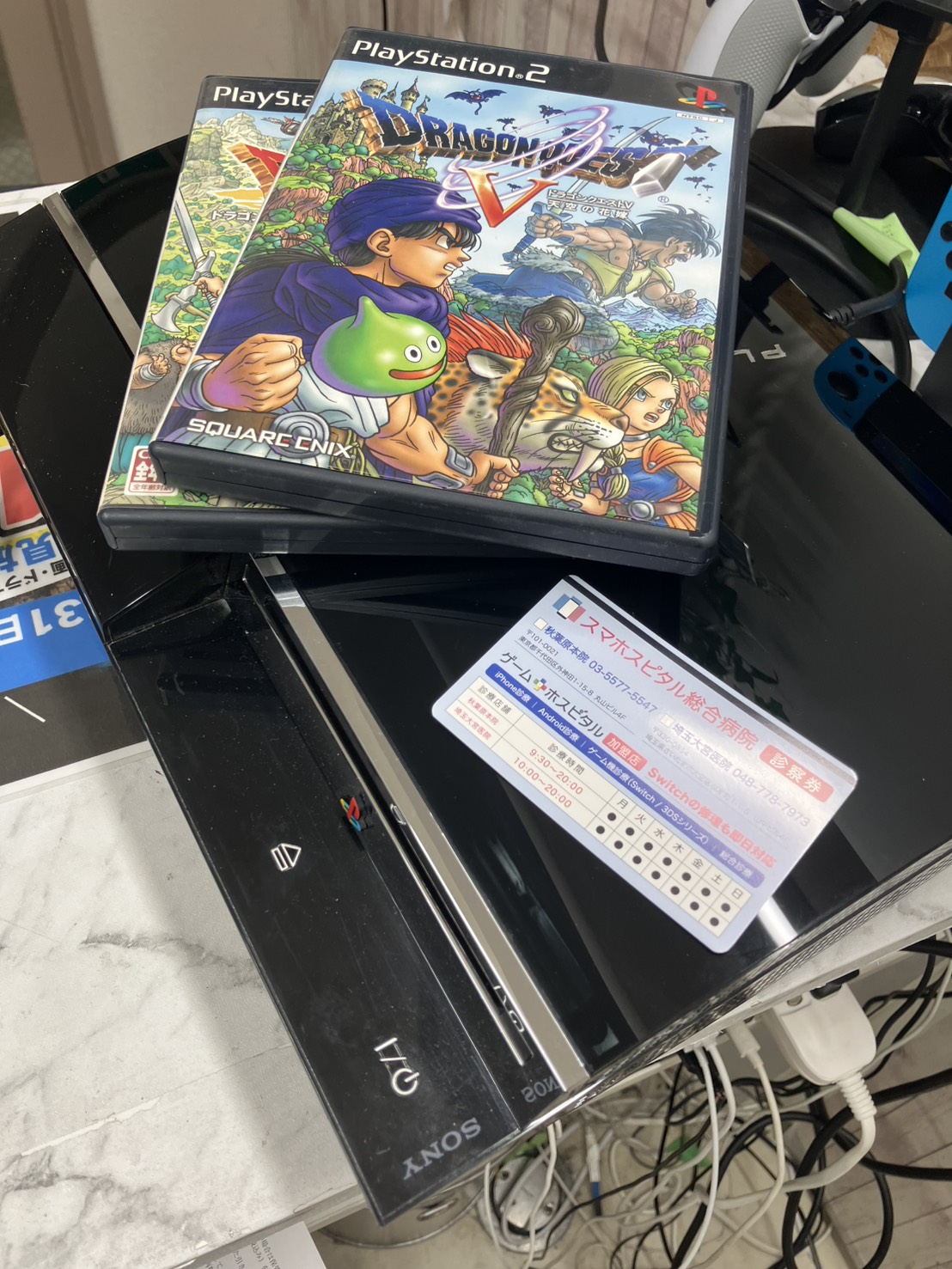 レーザーレンズデッキ交換が完了したPS3 CECHA00と同梱のゲームソフト・修理保証書
